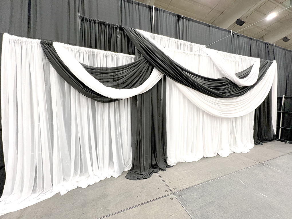 Black and white draped event backdrop display