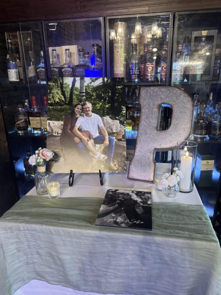 Engagement photo display with candles and large letter