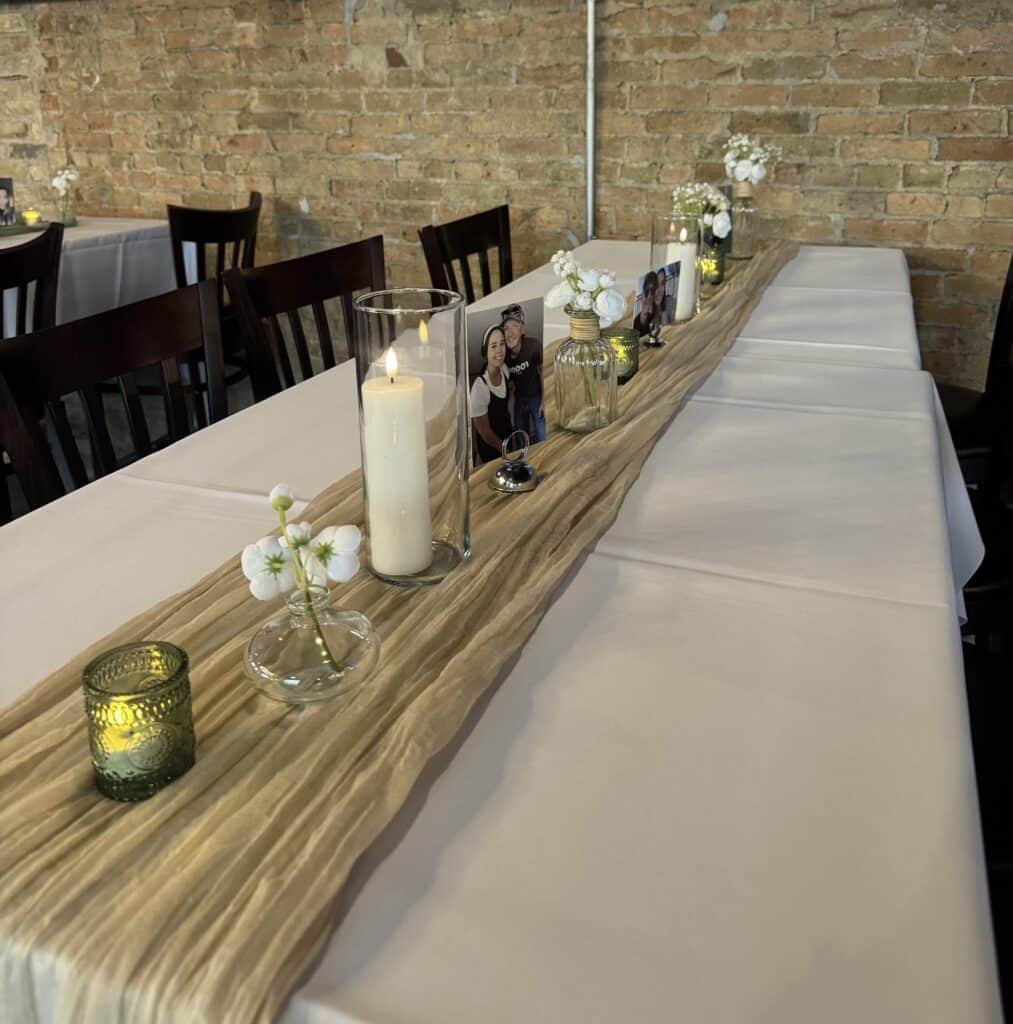 Elegant candlelit table with photos and flowers