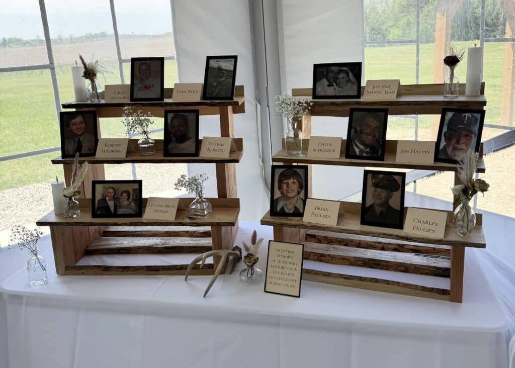 Memorial display with framed photos and candles