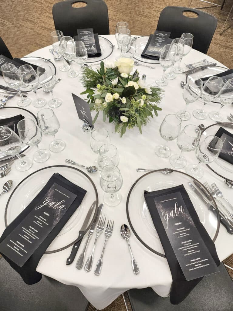 Elegant gala table setting with floral centerpiece