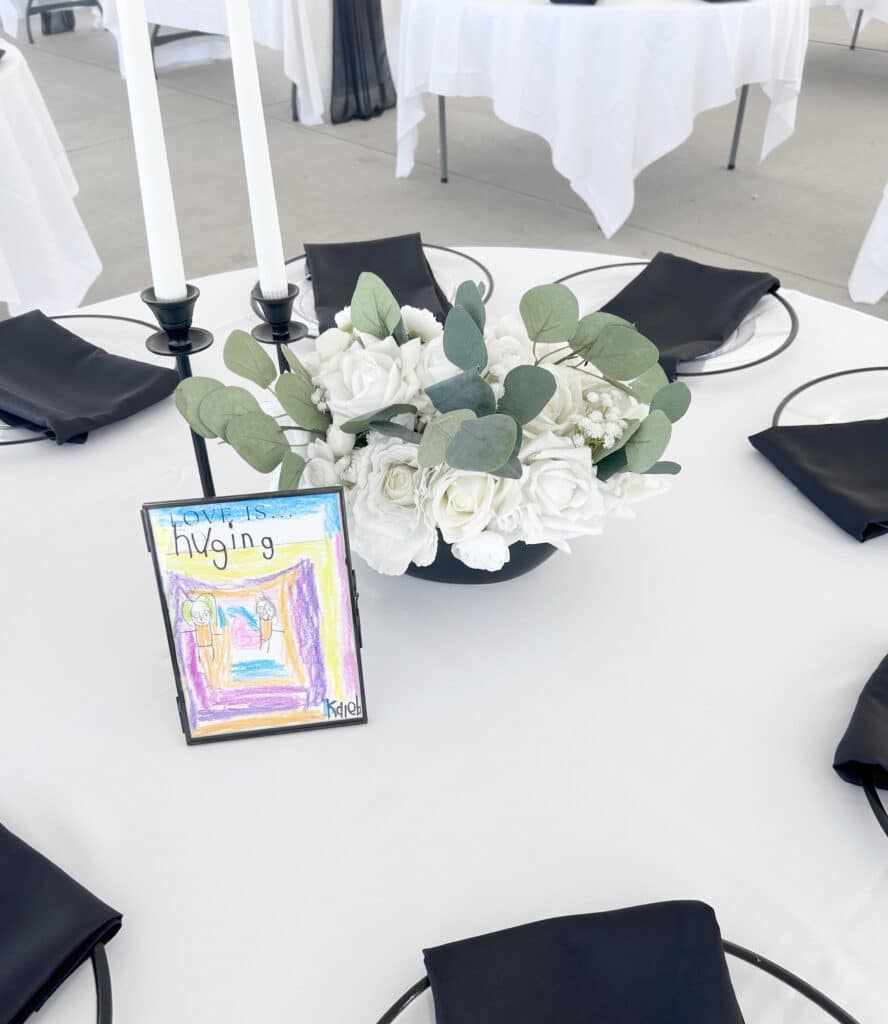 Elegant black-and-white wedding table with floral centerpiece