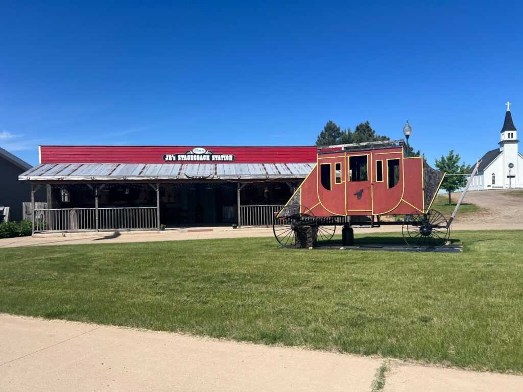 Stagecoach display outside JR's Stagecoach Station and church