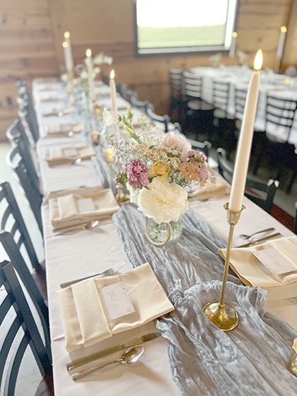 Elegant wedding reception table with flowers and candles
