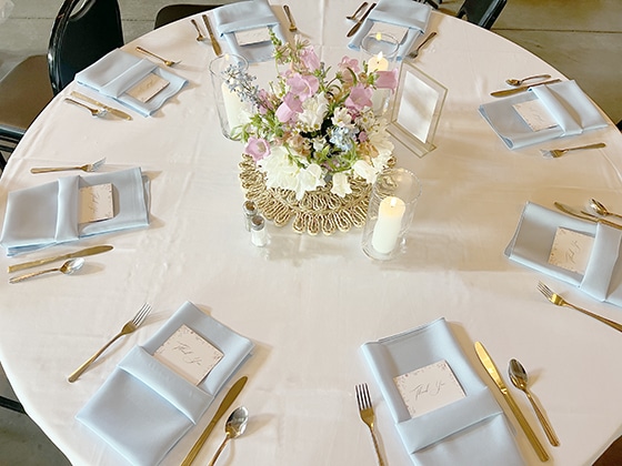 Elegant round table set for a formal wedding reception