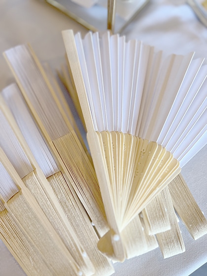 Handcrafted white and natural bamboo folding fans